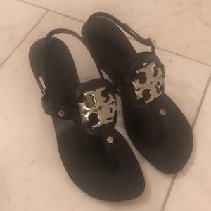 Tory Burch sandals with metal logo.